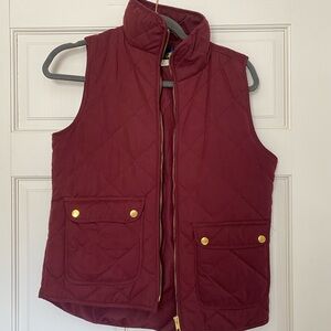 Burgundy quilted vest.